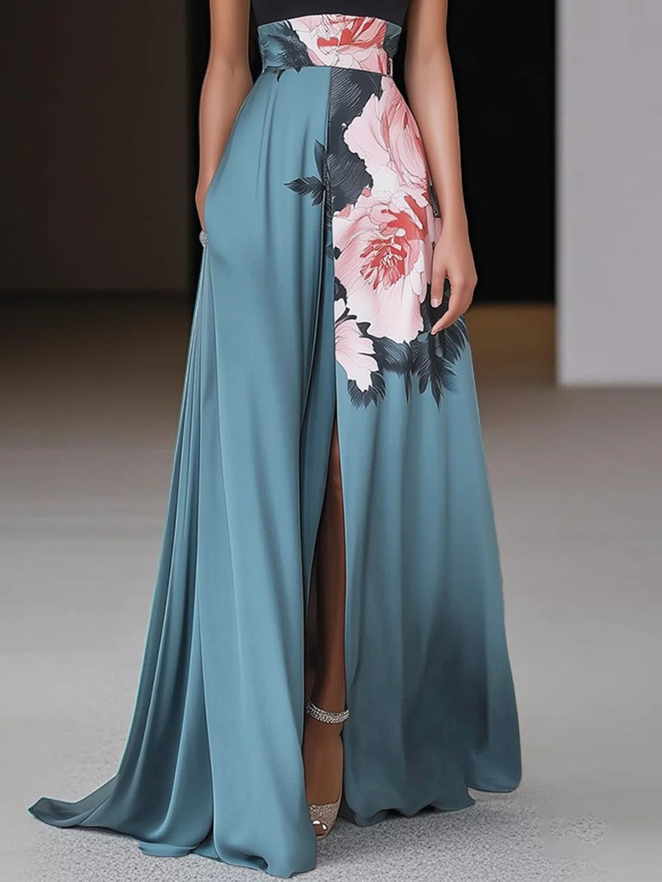 Side detail of floral maxi dress showing high slit, teal fabric drape, and peony print panel