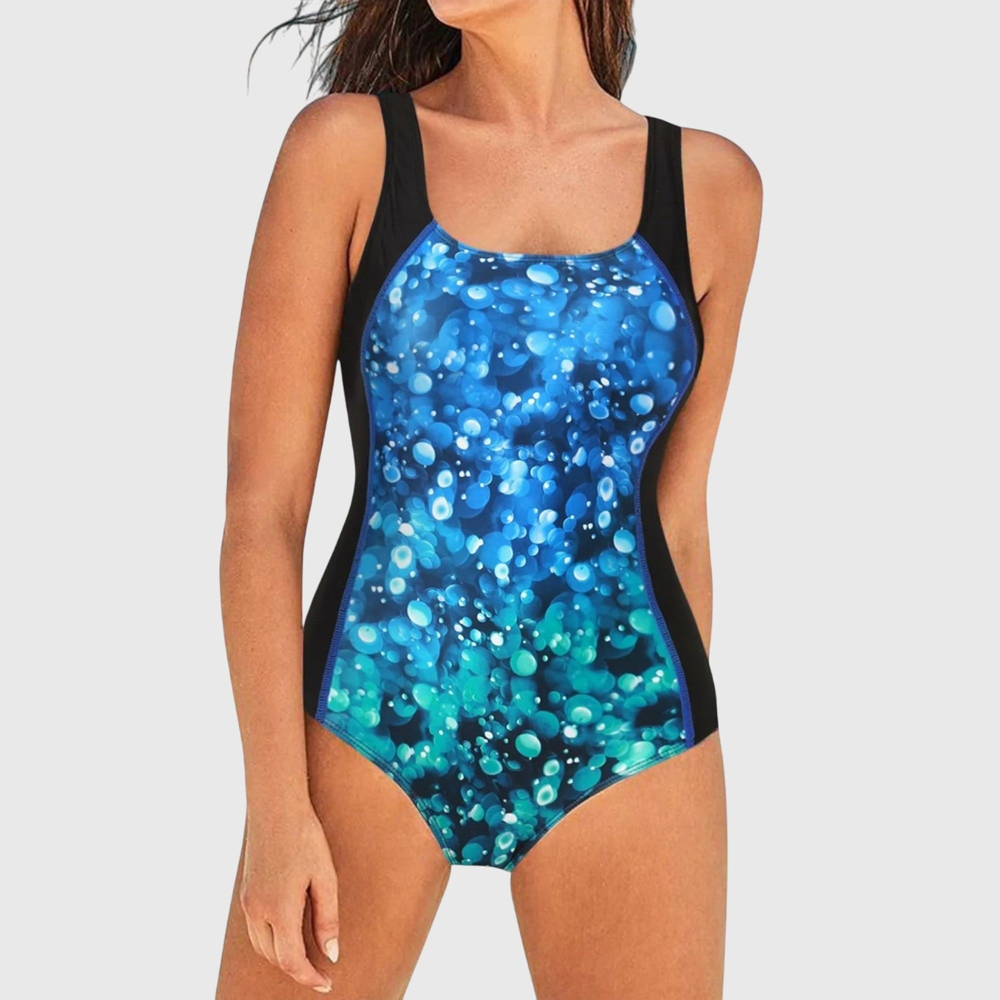 Women's one-piece swimsuit with blue bubble bokeh print and black control panels