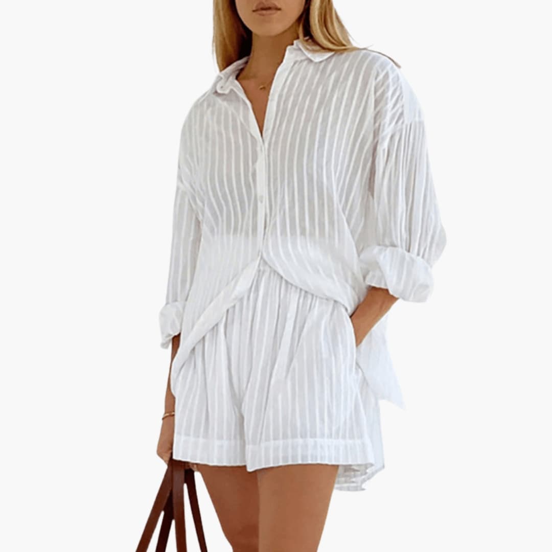 White pinstriped button-down collared pleated mini dress with puffed sleeves