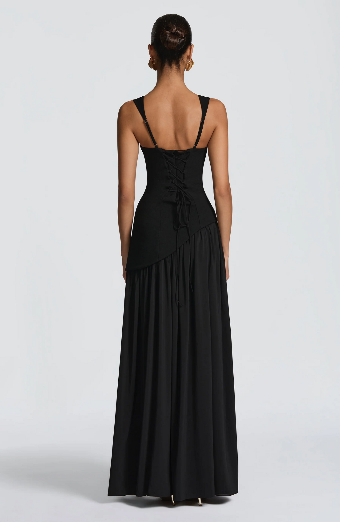 Black maxi dress back view with lace-up corset detail and adjustable straps