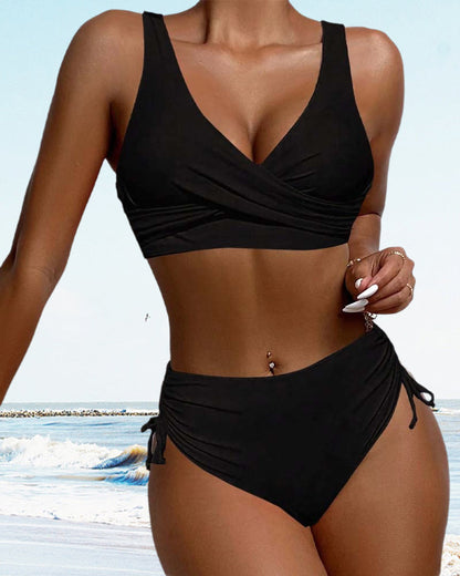 Black sleeveless v-neck bikini with adjustable tie bottoms on beach