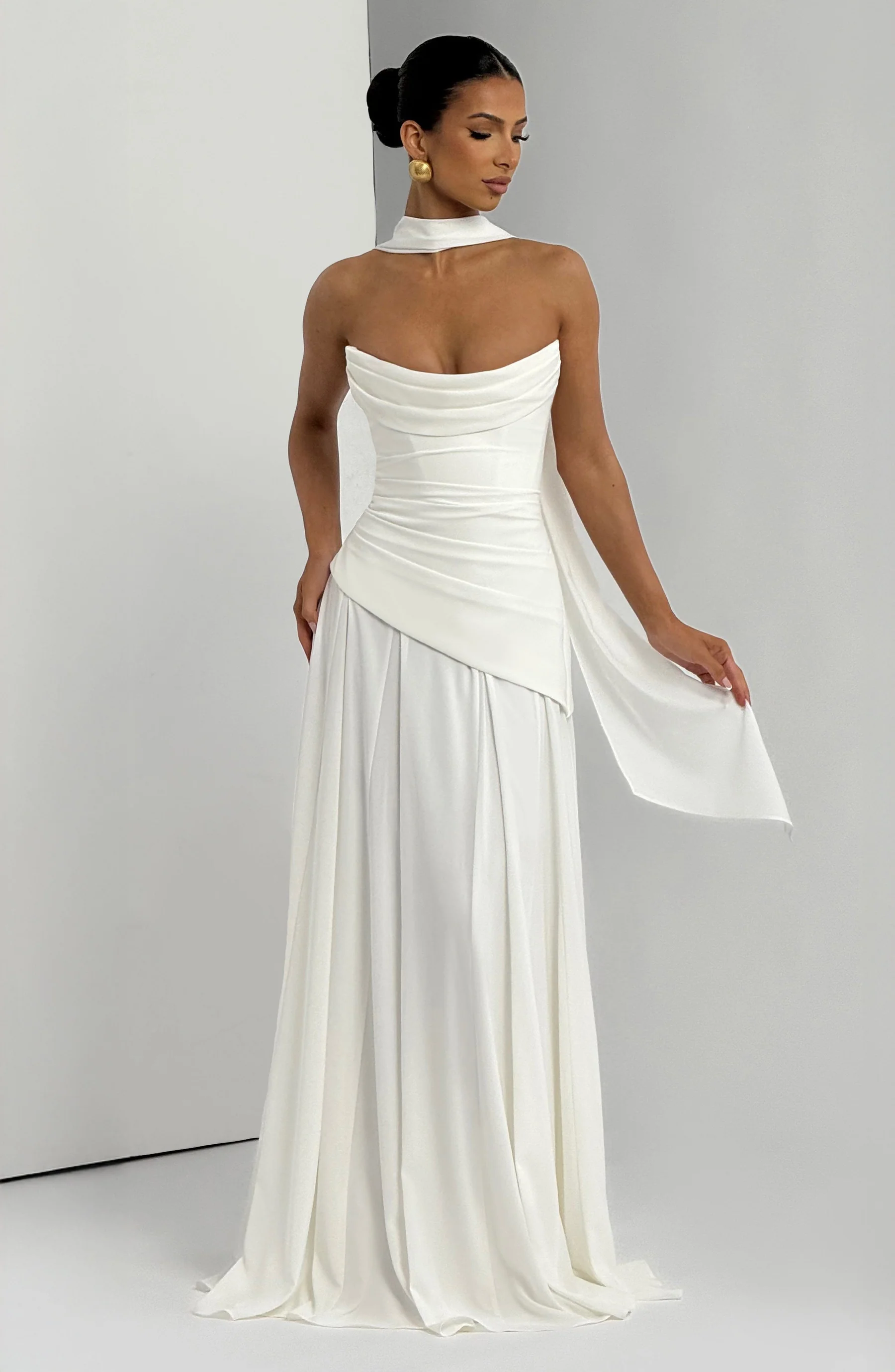 Ivory strapless cowl neck maxi dress with draped bodice and flowing skirt back view