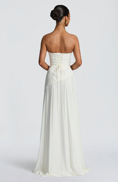 Ivory strapless cowl neck maxi dress with lace-up corset back and flowing hem