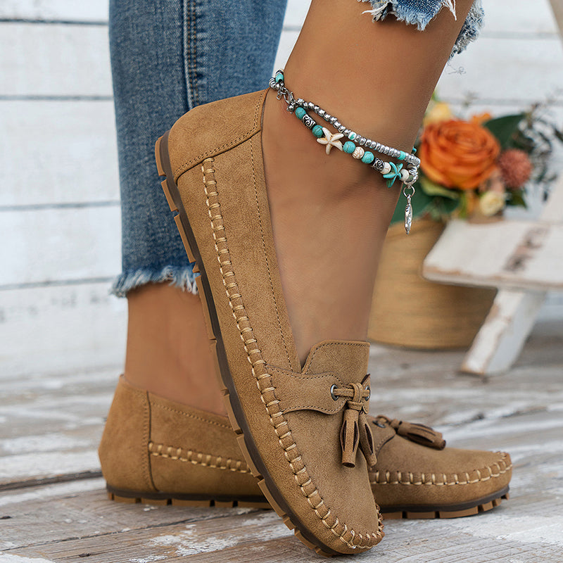 Camel suede bow loafer with visible stitched sole and cushioned footbed