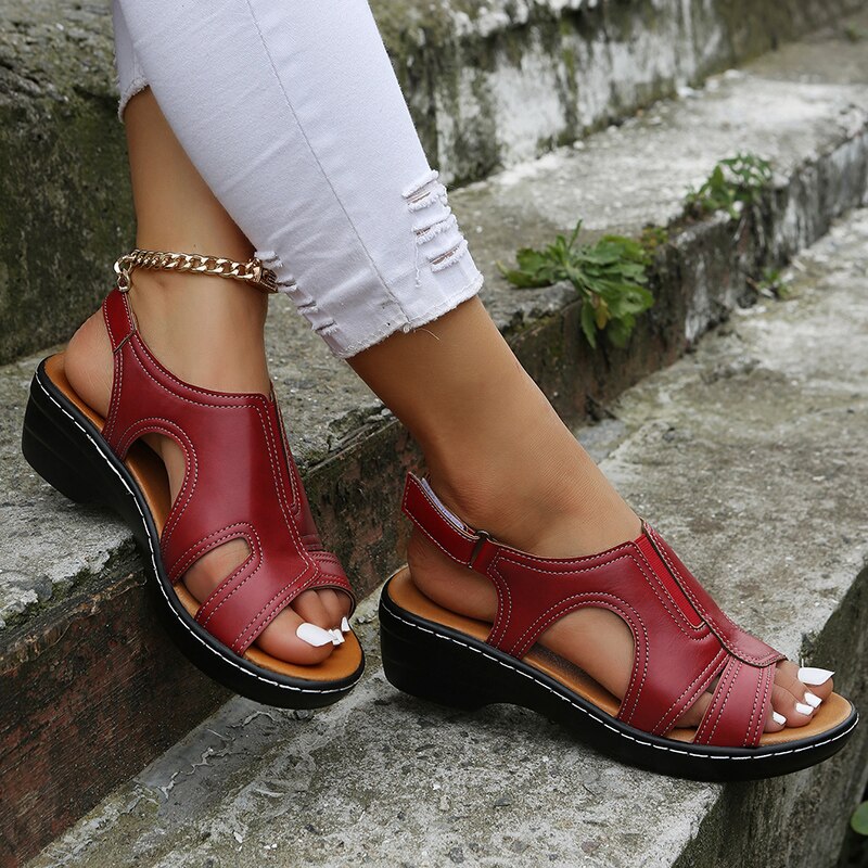 Burgundy red orthopedic sandals with open toe design and adjustable strap