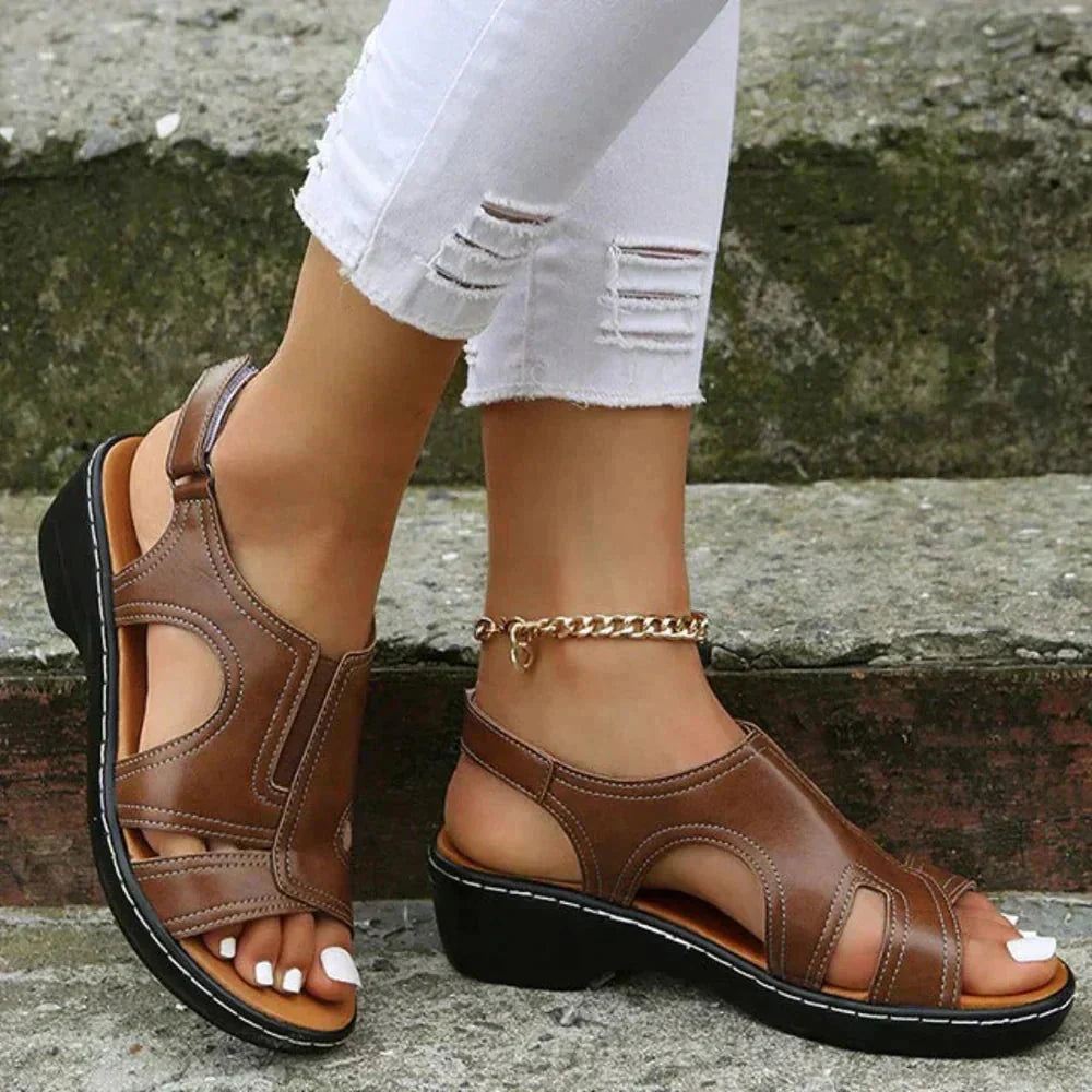 Brown leather orthopedic open toe sandals with adjustable strap and black sole