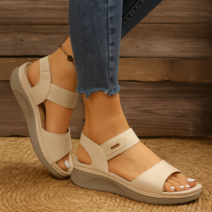 Cream adjustable platform sandal with ankle strap and chunky sole, front angle view
