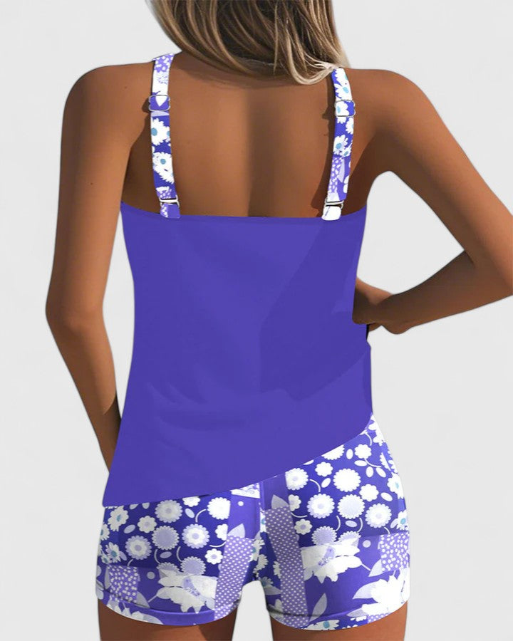 Purple tankini with white daisy print shorts back view
