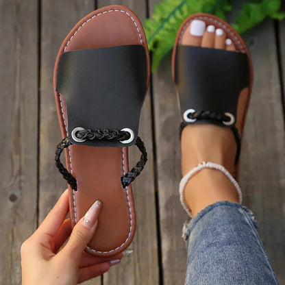 Black and tan leather slide sandal with black braided strap accent