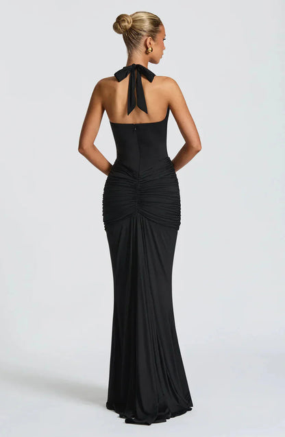 Back view of black halter maxi dress with tied neck detail