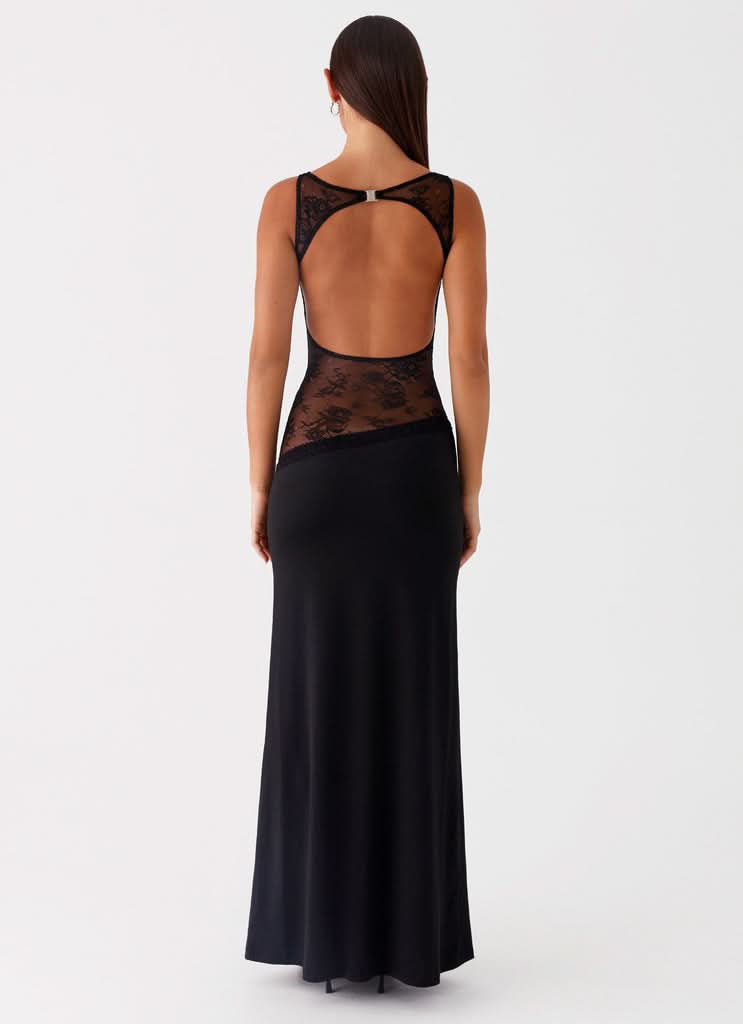Black maxi dress with open back and lace cutout detail, rear view