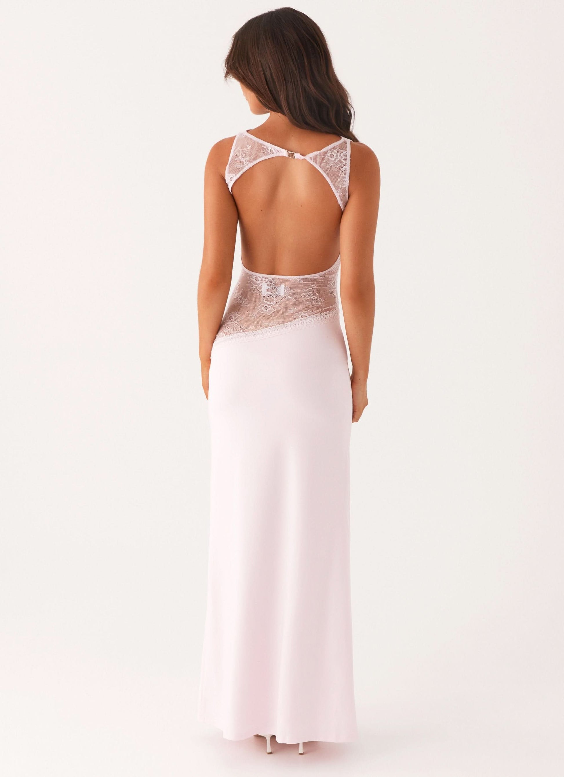 Pale pink maxi dress with open back and lace cutout detail, rear view