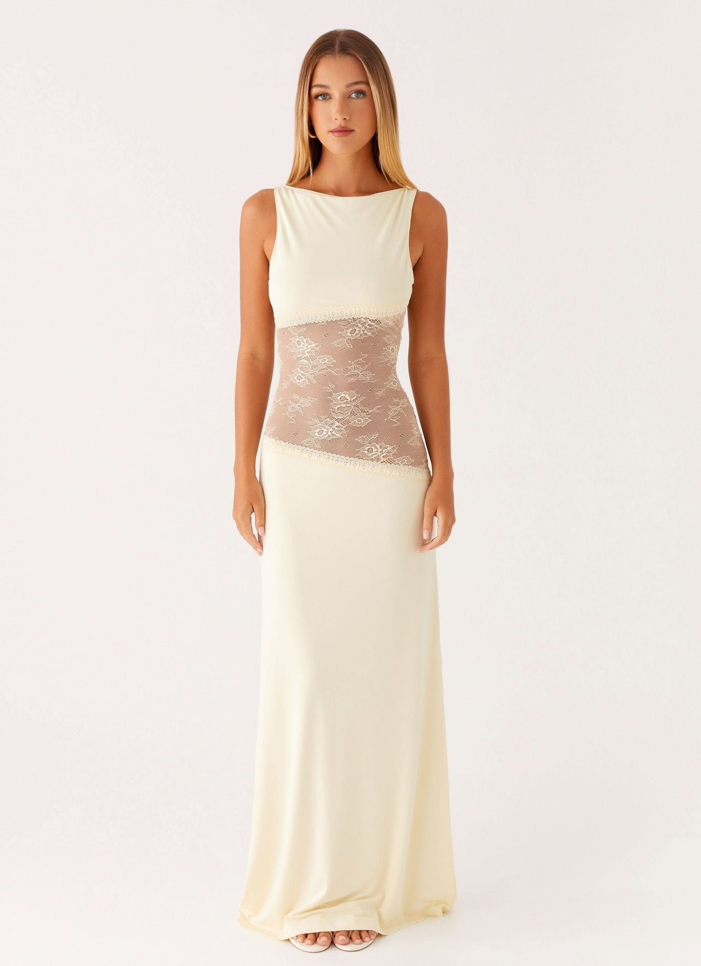Cream sleeveless maxi dress with lace cutout at waist, front view