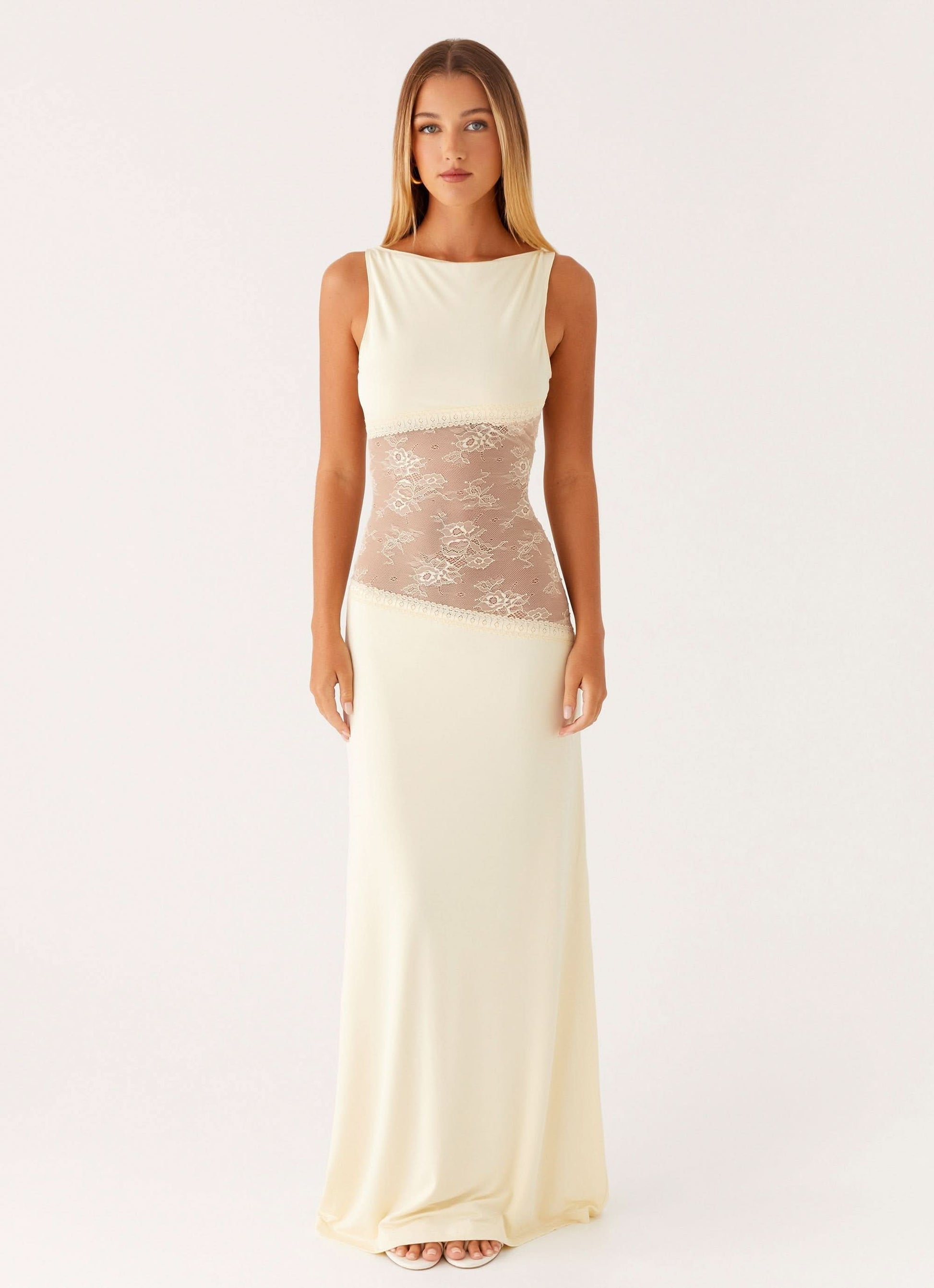 Cream sleeveless maxi dress with lace cutout at waist, front view