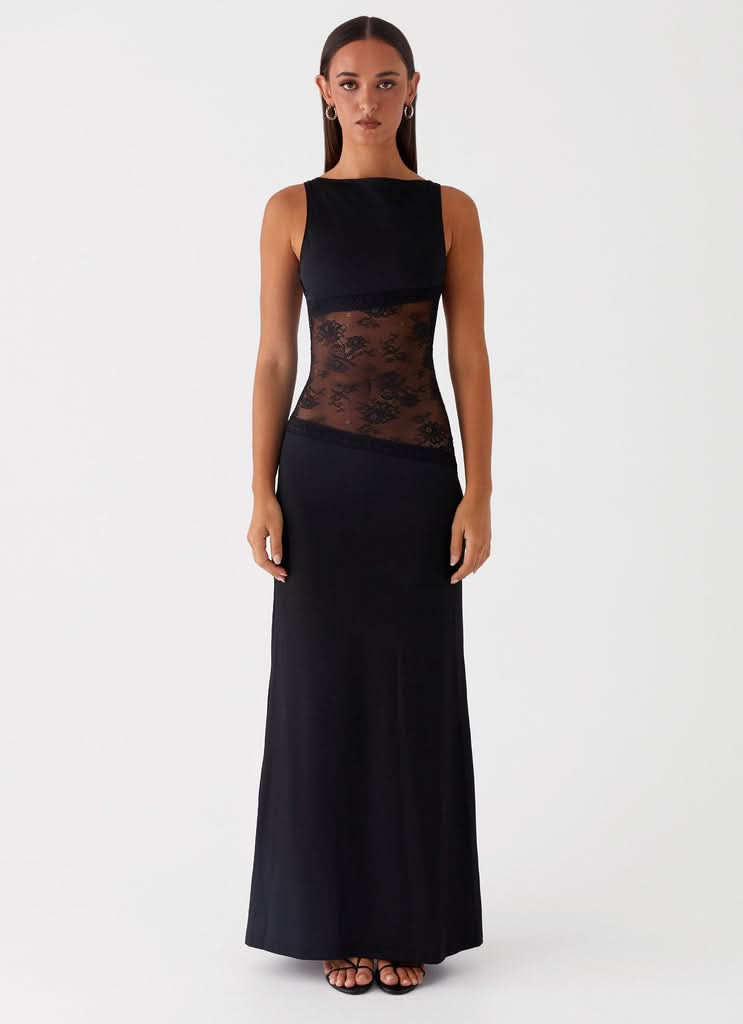 Black sleeveless maxi dress with lace cutout at waist, front view