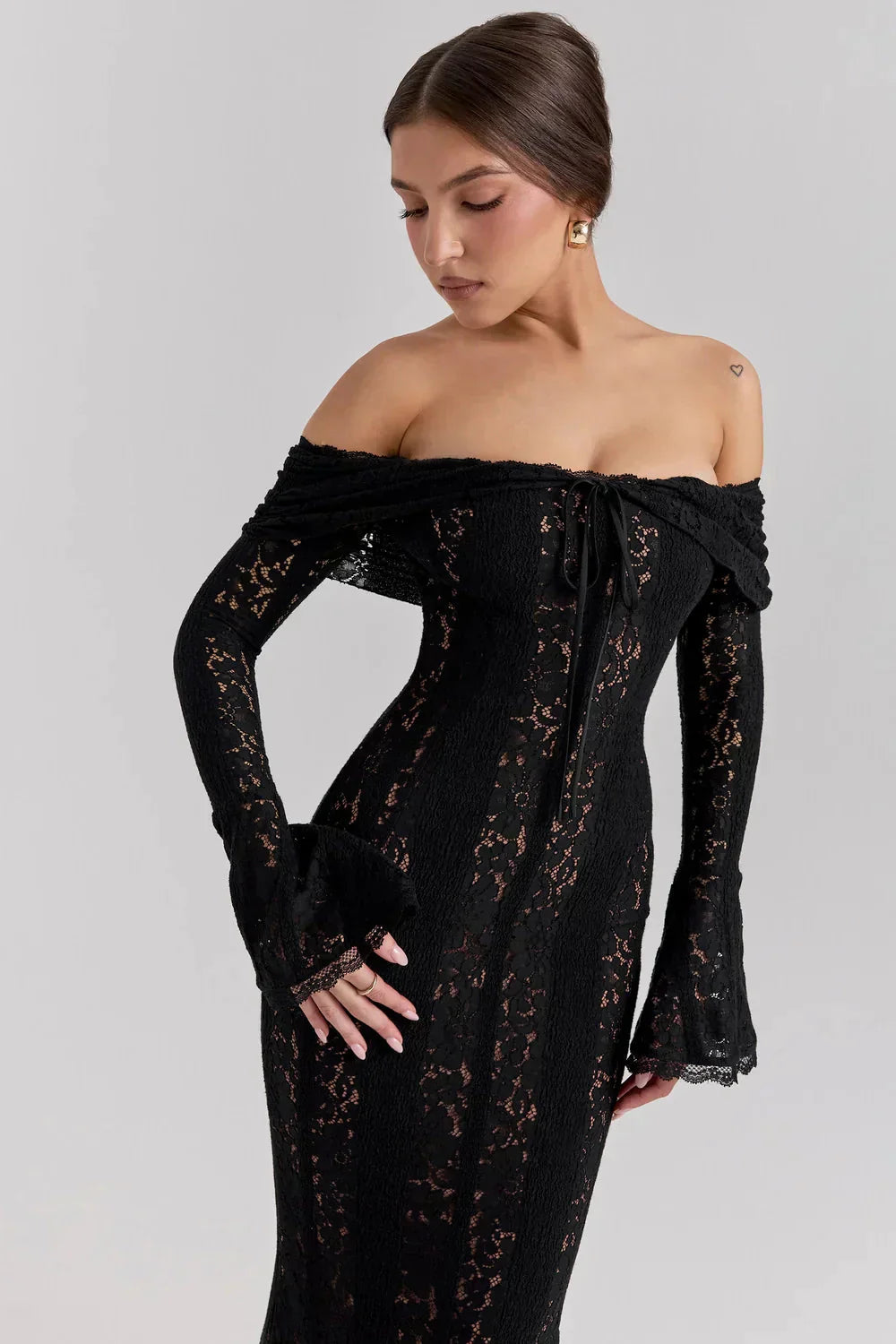 Off-shoulder black lace maxi dress with bell sleeves and sheer lace panels