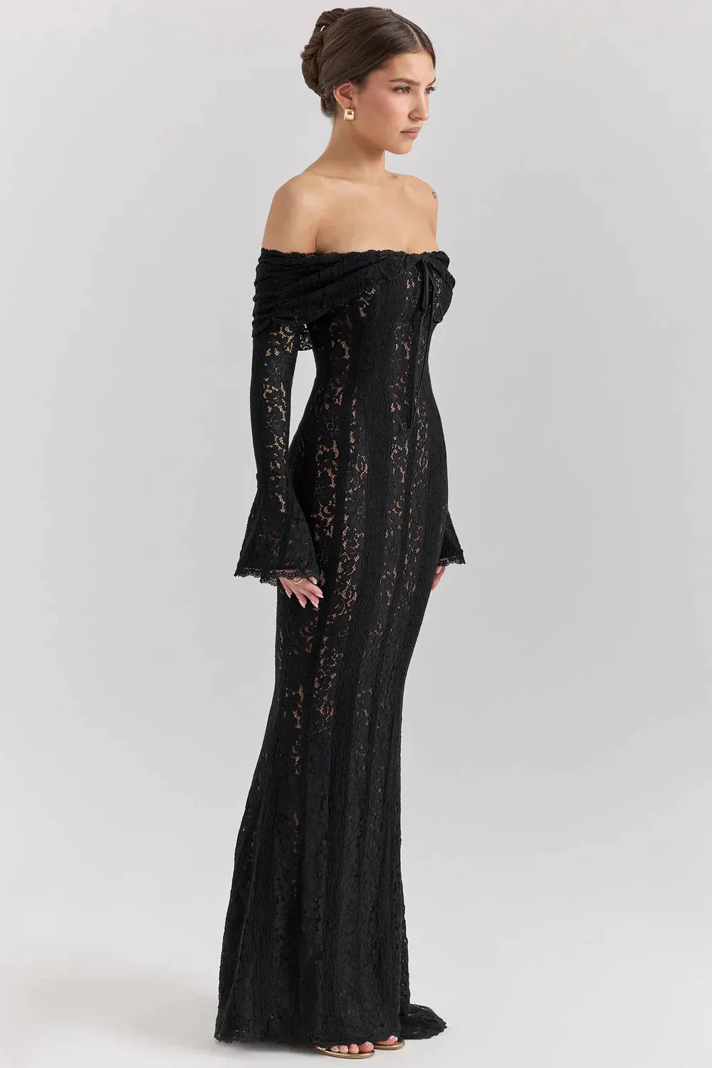 Side view of black lace off-shoulder maxi dress with bell sleeve detail