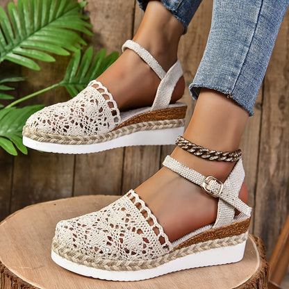 Cream crochet lace sandal with adjustable ankle strap and rope espadrille sole, worn on foot