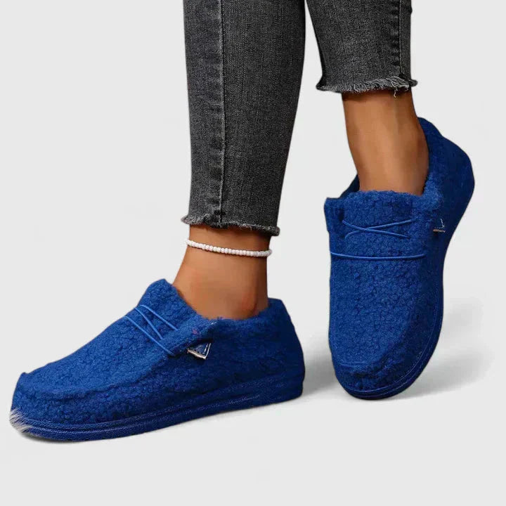 Royal blue fleece moccasin loafers with cozy wool lining and cord trim