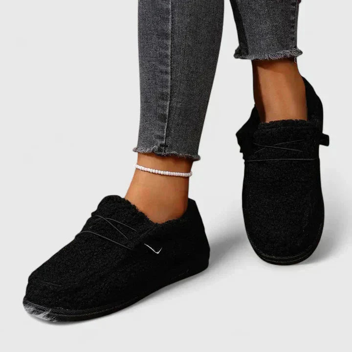 Black fleece moccasin loafers with soft textured upper and metal detail