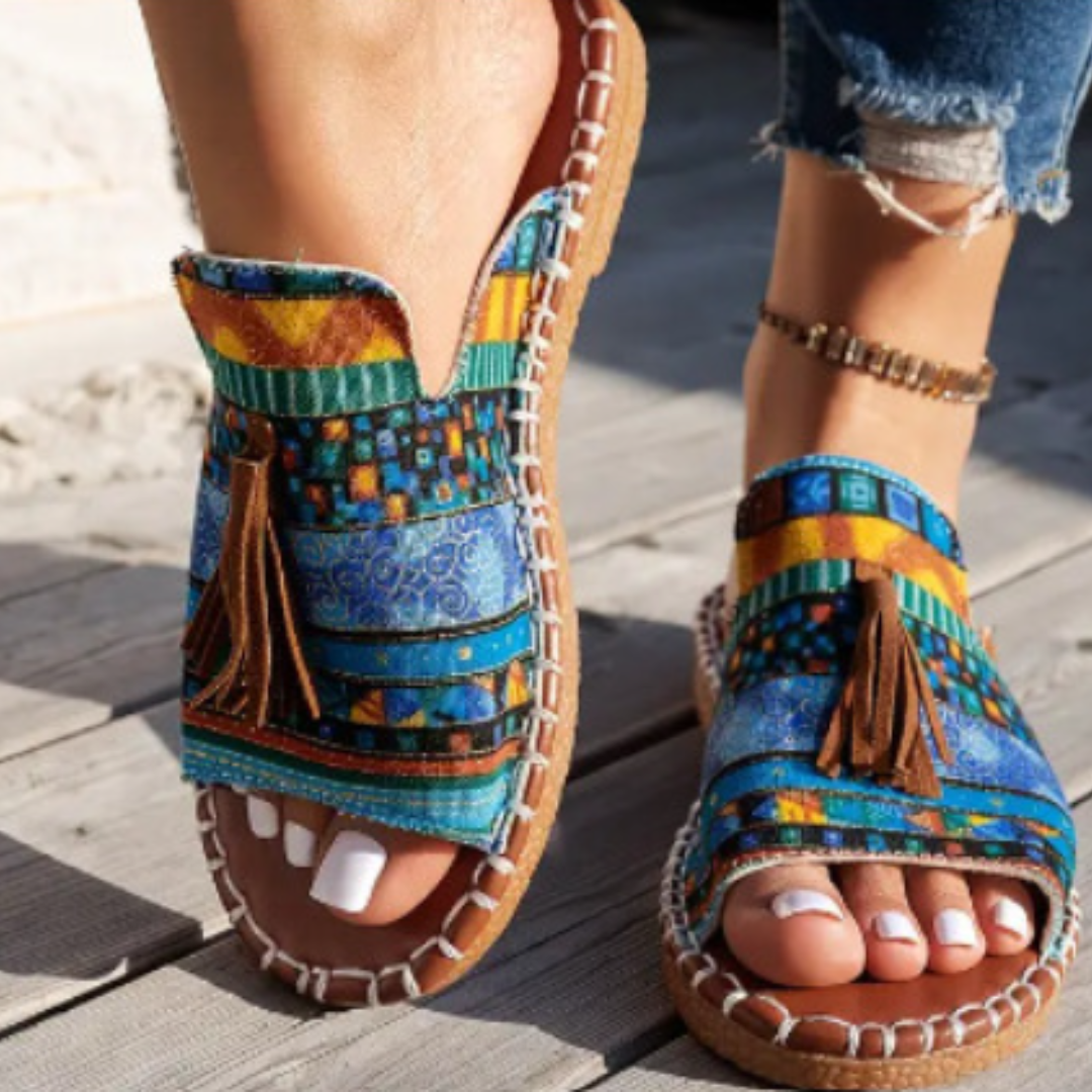 Platform sandals with blue and yellow geometric patterns, brown tassels, cork sole