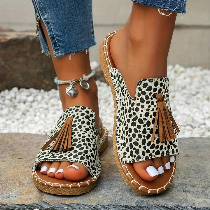 Black and white polka dot platform sandals with brown tassel and cork platform
