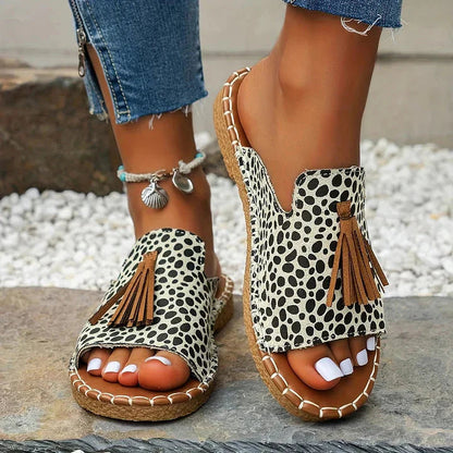 Black and white polka dot platform sandals with brown tassel and cork platform