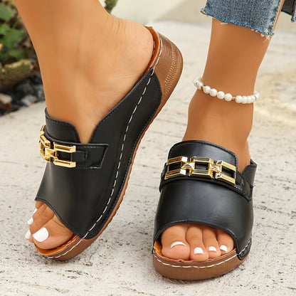 Black leather platform sandals with gold chain accent and textured sole