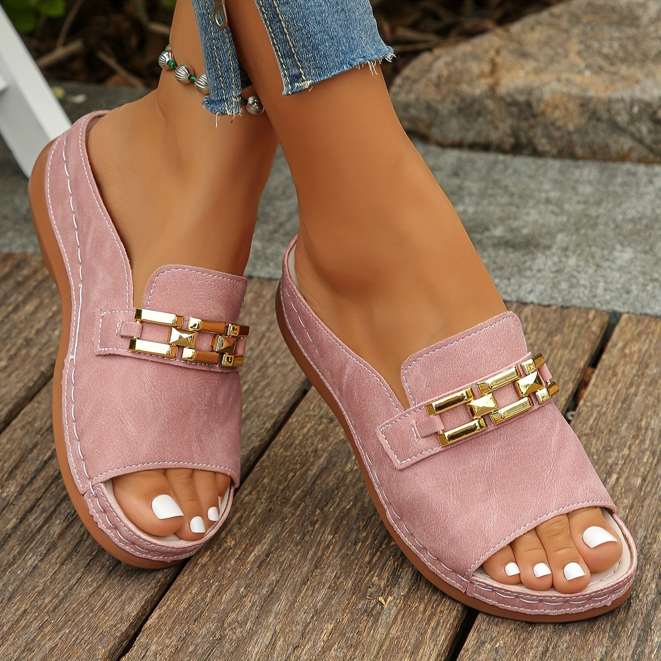 Pink suede cushioned platform slide sandals with gold chain detail