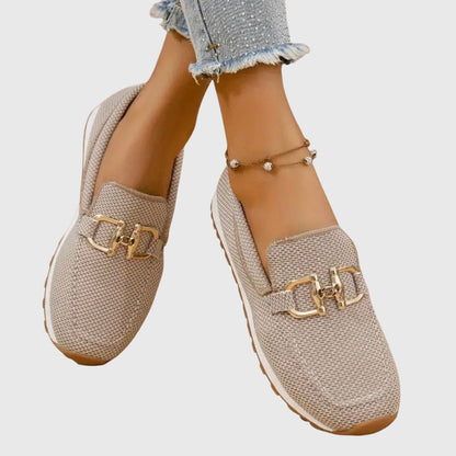 Beige mesh horsebit loafers with gold buckle detail, front view on feet