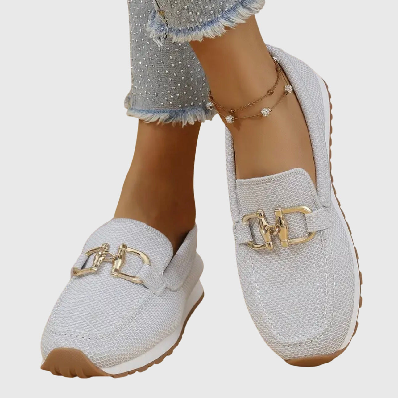 White mesh horsebit loafers with gold hardware and cushioned sole