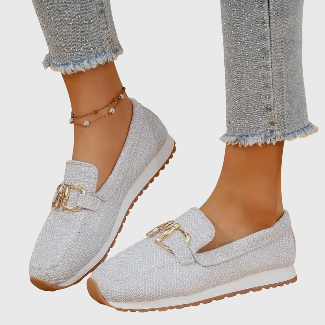 White mesh horsebit loafer with gold bit hardware, side profile view