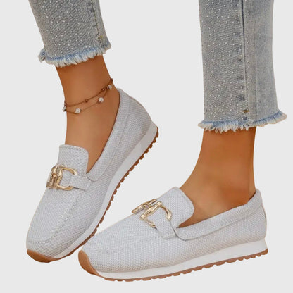 White mesh horsebit loafer with gold bit hardware, side profile view