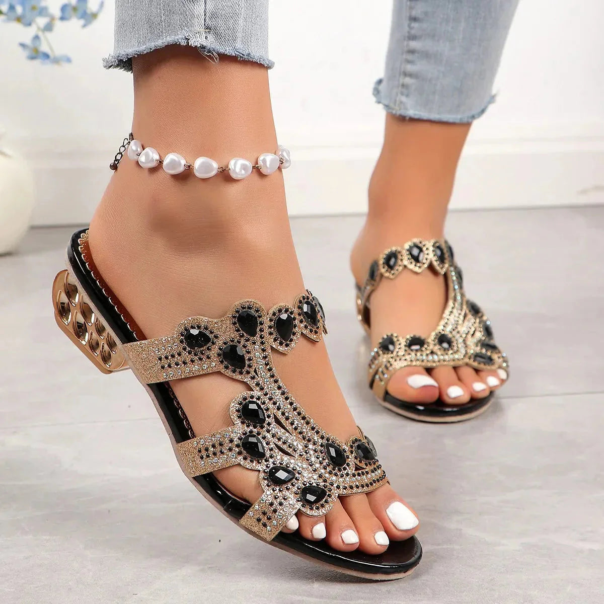 Gold glitter embellished strappy sandal with black crystal accents and low block heel