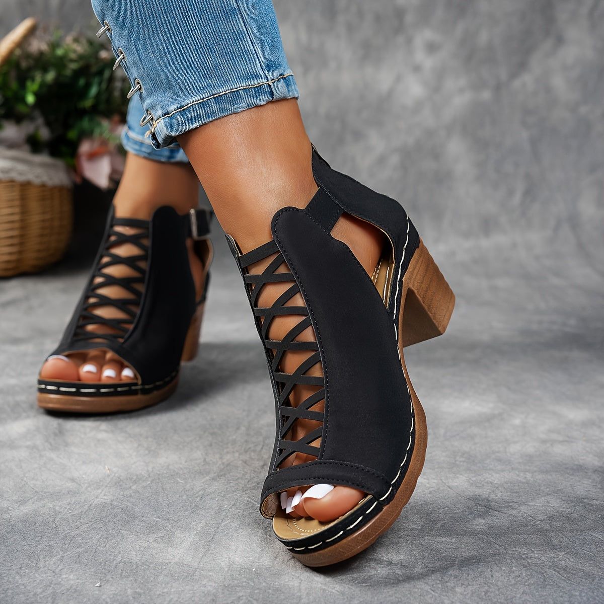 Side view of black lace-up platform sandals with contrast stitching