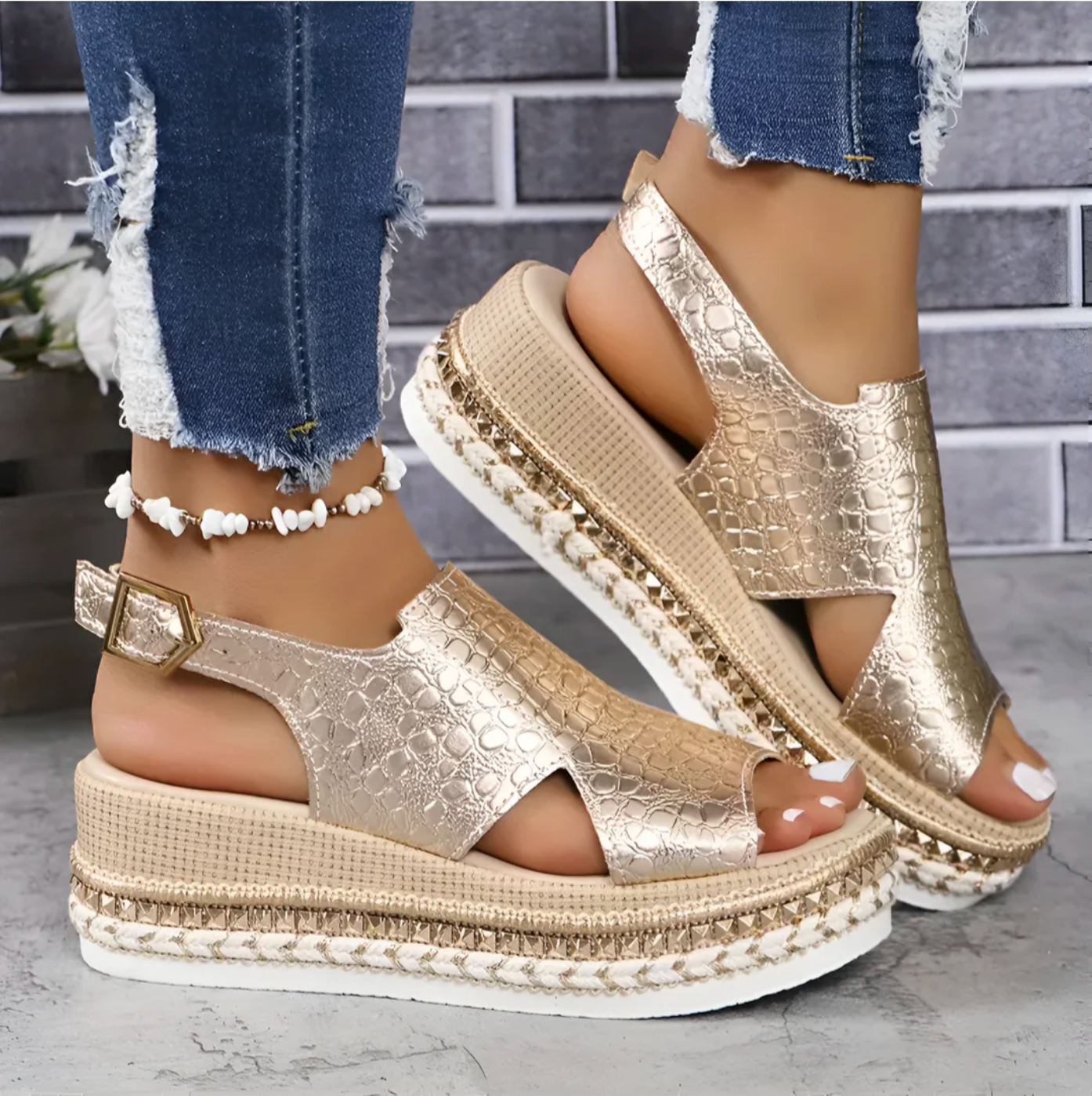 Side view of metallic gold platform sandals with buckle ankle strap