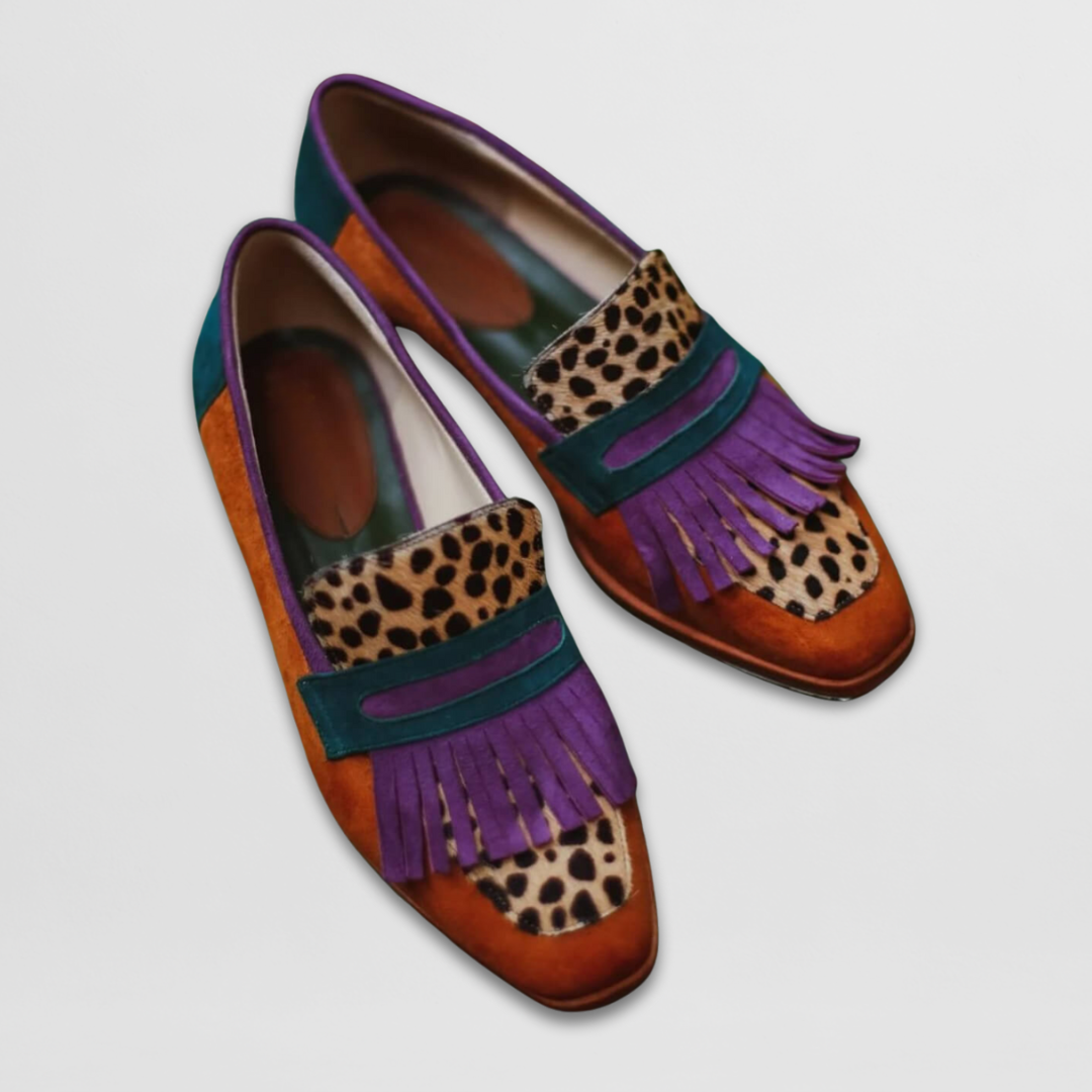 Leopard print loafers with purple fringe trim, teal and orange colorblock design detail