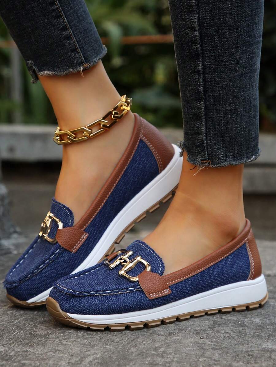 Navy and brown color-block loafer with gold metal hardware