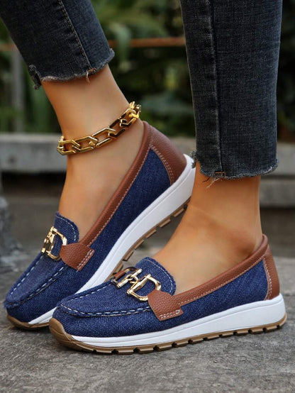 Navy and brown color-block loafer with gold metal hardware