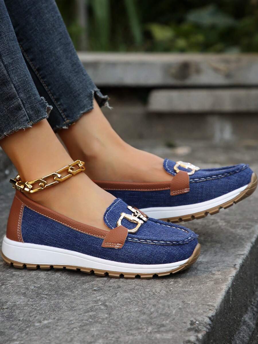 Navy denim loafer with cognac trim and gold buckle hardware