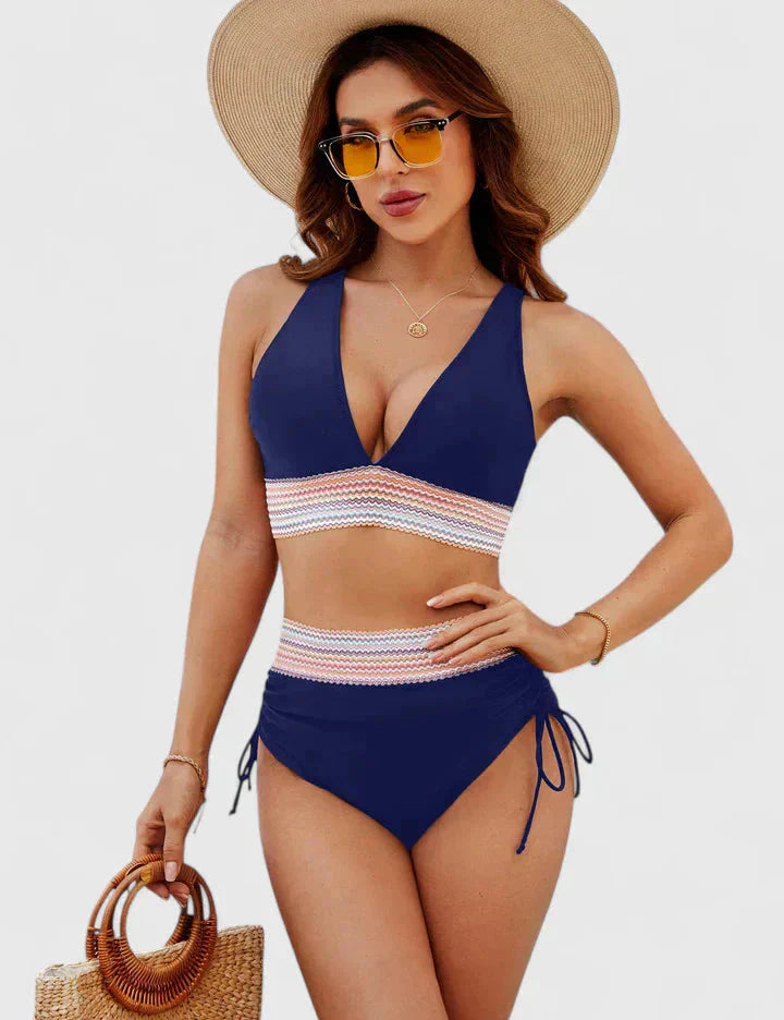 Navy blue high-waisted halter bikini with multicolor geometric stripe detail