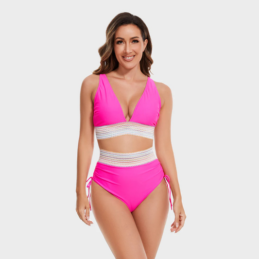 pink halter bikini with multicolor striped waistband and high-waisted bottoms
