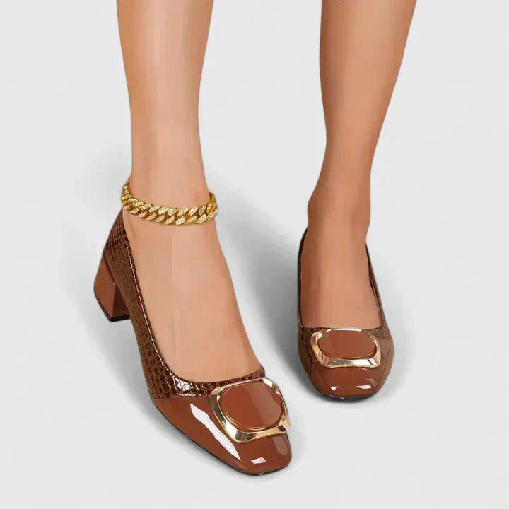 Brown crocodile embossed loafers with low block heel and gold buckle detail