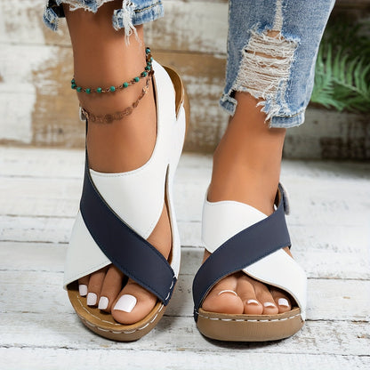 White and black color-block platform wedge sandals with cushioned tan sole