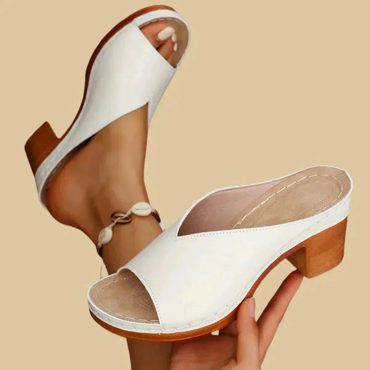 White leather block heel mule sandal with open toe design