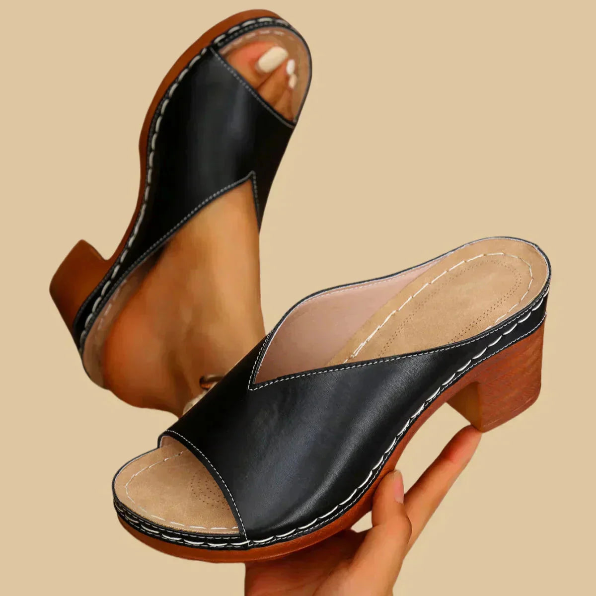 Black leather open toe mule with wooden block heel and stitching