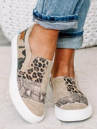 Beige canvas slip-on sneaker with leopard print panel and snake texture detail