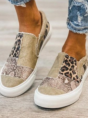 Front view of animal print canvas sneaker showing leopard and snake pattern combination