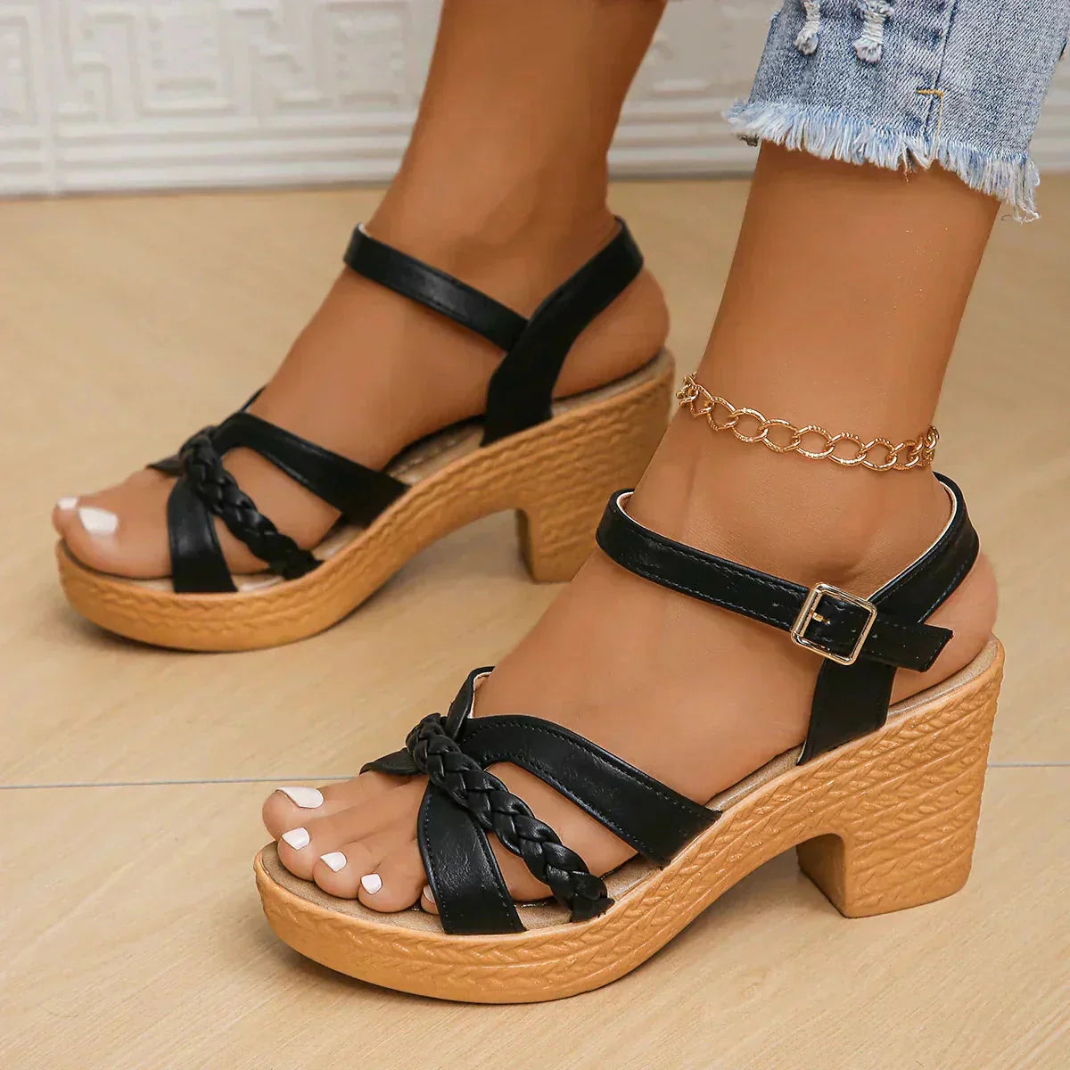 Black and natural platform sandal with braided straps and ankle buckle
