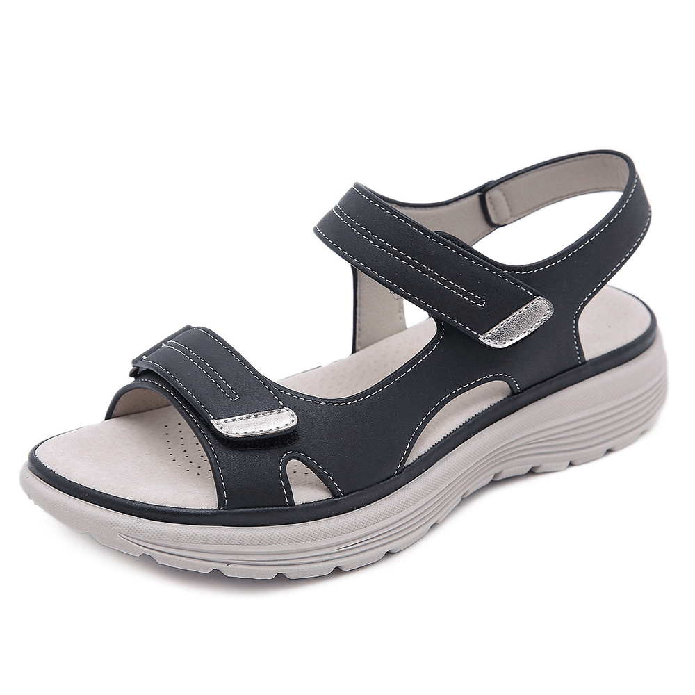 Black velcro sandal with wide toe design and white sole